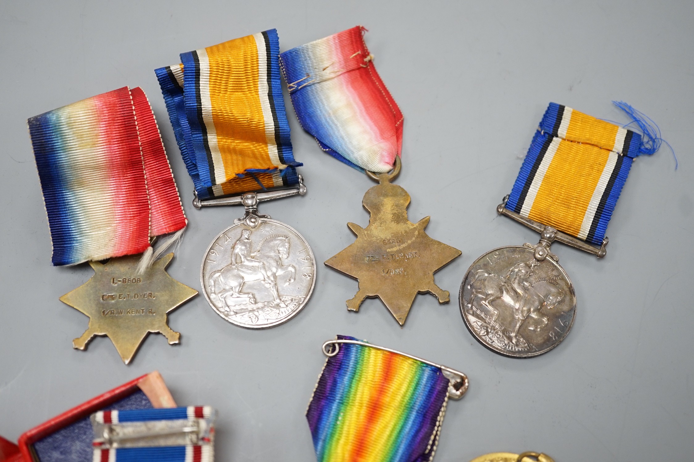 WWI and later medals - Mons star (with bar and rosette) trio to 6480 PTE. F. TURNER 1/DNS., a Mons star pair to L-8608 CPL. E.T. DYER. 1/R W. KENT R., an unnamed Great War medal and a boxed George VI coronation medal (7)